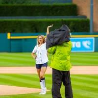 3 individuals on the field at Comerica Park